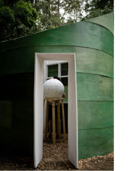 Entry threshold to installation with framed white opening 