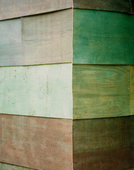 Material detail of stained plywood cladding in architectural installation 